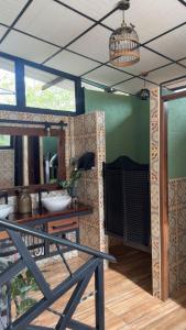 a room with a mirror and a table with a sink at Finca Campestre Villa del Campo in Santa Rosa de Cabal +153 photos