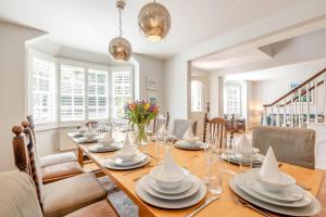 a dining room with a long table and chairs at 6 Bed in Hadlow Down oc-g36329 in Hadlow Down