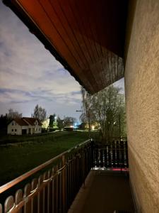 a view from the balcony of a house at Rooms near Balice airport in Cholerzyn