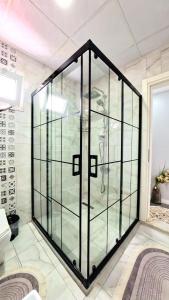 a glass elevator in a room with white walls at PRETTY HOUSE in Pamukkale +74 photos