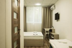a hotel room with two beds and a window at Hotel BK in Kyiv +46 photos