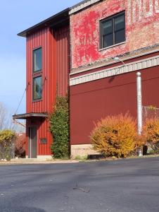 a red building on the side of a street at Classic Pied a Terre in Benton Harbor