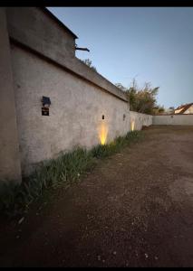 a building with two lights on the side of it at Studio 16 proche du PAL in Dompierre-sur-Besbre