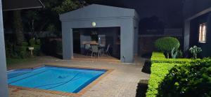 a house with a swimming pool in a yard at Maison Akiba in Pretoria +66 photos