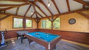 a room with a pool table in a cabin at House Kiki by Villas Guide in Bosiljevo