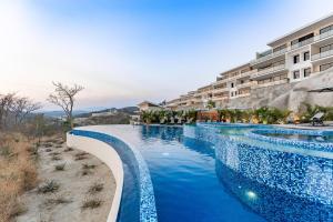 an image of a swimming pool at a hotel at 3101 - Paradise Cove 1A Violin in Tangolunda