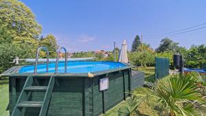 a swimming pool with a ladder next to afficientfficientfficientfficientfficient at House Kiki by Villas Guide in Bosiljevo