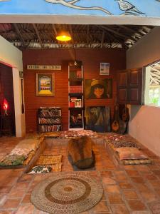 a room with several beds on the floor in a room at POUSADA e HOSTEL SÍTIO PARAÍSO DO CAJU in Barreirinhas