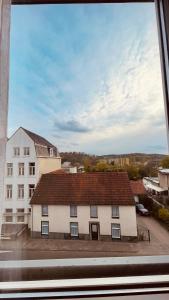 a large white building with a red roof at Hotel Heynen in Valkenburg +19 photos