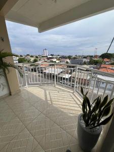 a balcony with a plant in a pot at Modern apartment, with excellent location in Macapá