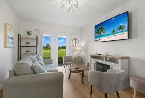 a living room with a couch and a fireplace at Chic 3BR, 2BA -Brand New! in Englewood