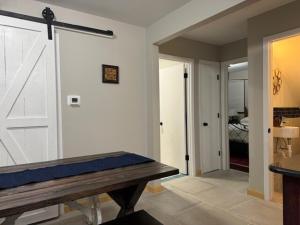 a room with a white door and a wooden table at Sunnyside Rental-Entire vacation home 3 Bedroom 2 Bathrooms 1 Kitchen in McHenry