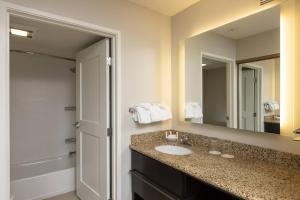 a bathroom with a sink and a mirror at Residence Inn by Marriott Durango Downtown in Durango +16 photos