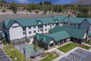 an aerial view of a hotel with a tennis court at Residence Inn by Marriott Durango Downtown in Durango