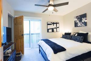 a bedroom with a bed and a ceiling fan at Luxuriously Contemporary Condo WL1401 Powder Mtn in Eden