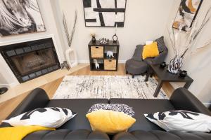 a living room with a couch and a fireplace at Luxuriously Contemporary Condo WL1401 Powder Mtn in Eden