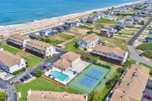 an aerial view of a house with a tennis court at Ocean Views From Every Room in Kitty Hawk