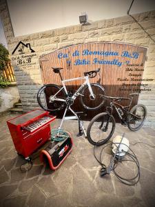 two bikes are parked in front of a wall at Ca' di Romagna B&B in Civitella di Romagna
