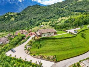 an aerial view of a house in the mountains at Agriturismo Hegemone in Tremosine Sul Garda