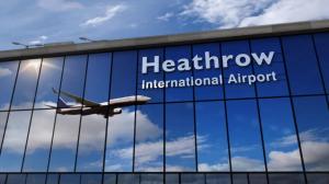 an airplane is flying through the window of an airport at London Heathrow Uxbridge Escape in Uxbridge