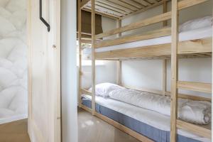 a bunk bed room with two bunk beds at Rekerlanden 270 in Warmenhuizen +13 photos