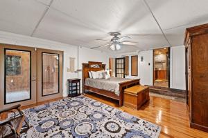 a bedroom with a bed and a ceiling fan at Big Bear Falls in Ellijay