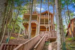 a tree house with a staircase leading up to it at Big Bear Falls in Ellijay