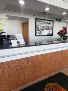 a view of the counter of a restaurant at Super 8 by Wyndham Chicago Northlake O'Hare South in Northlake