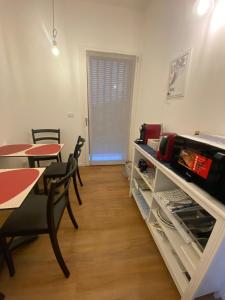 a dining room with tables and chairs and a window at Room259 in Treviso