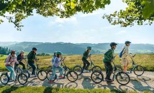 a group of people riding bikes on a road at Hirsere Studio 2 in Ursenbach