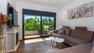 a living room with a couch and a table at Villa Angello in Matulji