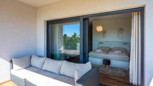 a living room with a couch and a bed at Villa Angello in Matulji +43 photos