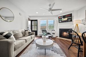 a living room with a couch and a fireplace at Welcoming Wolf Getaway WL1405 Ski Escape Hot Tub in Eden +41 photos