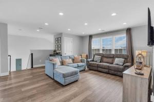 a living room with a couch and a table at Prof Cleaned | Fast WiFi | BBQ | Linen & Towels in Seaside Heights