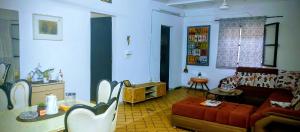 a living room with a couch and a table at Village Tenko in Ouagadougou