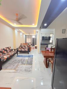 a living room with a couch and a table at Elegant villa getaway in Jaipur
