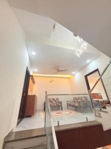 a view of the living room from the stairs at Elegant villa getaway in Jaipur