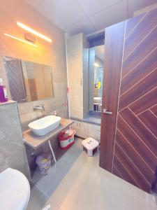 a bathroom with a sink and a toilet and a shower at Elegant villa getaway in Jaipur +20 photos