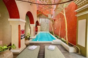 a swimming pool in a building with a courtyard at El Sueño Hotel & Spa in Puebla +63 photos