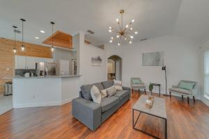 a living room with a couch and a table at Elegant 5BR Retreat w Private Pool & Game Room in Mesquite