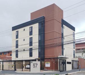 a building with a sale sign in front of it at Modern Studio 102 proximo Anashoping in Anápolis
