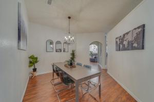 a dining room with a table and chairs in it at Elegant 5BR Retreat w Private Pool & Game Room in Mesquite