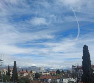 a view of a city under a cloudy sky at Aria Apartmani in Podgorica