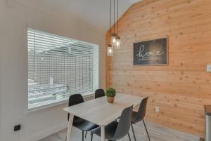 a dining room with a table and chairs and a window at Elegant 5BR Retreat w Private Pool & Game Room in Mesquite +45 photos