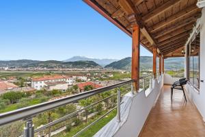 a balcony with a view of a city at Vila Palma in Berat