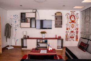 a living room with a couch and a table at Casa Antade Cusco in Cusco