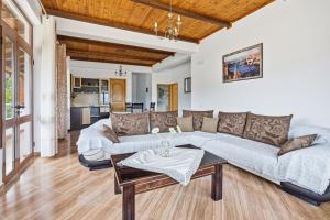a living room with a couch and a table at Vila Palma in Berat