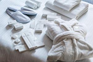 a pile of towels and other items on a table at Farovon Tashkent Boutique Hotel in Tashkent