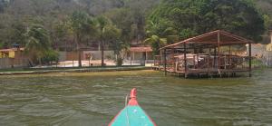 a view from the back of a boat in a body of water at Rancho citrus in Coruripe +9 photos