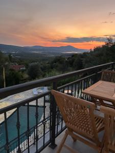 a view from the balcony of a house with a table at PoolSide Residence in Kavač